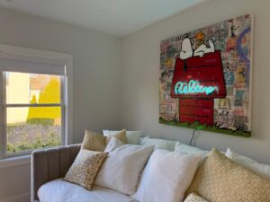 Hanging vibrant mixed-media artwork combines pop art, collage, and neon light